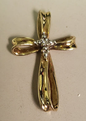 .59 dwt 10K gold cross with small round diamond